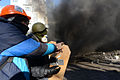 An unindentified protester armed with a gun. Clashes in Kyiv, Ukraine. Events of February 18, 2014