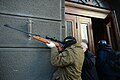 An unindentified protester armed with a rifle. Clashes in Kyiv, Ukraine. Events of February 18, 2014