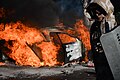 Car put on fire in the barricade line as clashes in Kyiv, Ukraine. Events of February 18, 2014-2