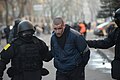Denetion of a protester by hardly identifiable supposedly military officers. Clashes in Ukraine, Kyiv. Events of February 18, 2014