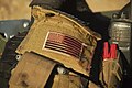 Flag on american volunteer doctor flack jacket covered with blood. Field hospital Mosul, Northern Iraq, Western Asia. 06 November, 2016.