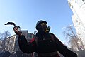 Masked protester holding Molotov Cocktails seen during clashes in Ukraine, Kyiv. Events of February 18, 2014
