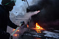 Grushevskogo str. covered with smoke of the fire set by the protesters to prevent internal forces from crossing the barricade line. Kyiv, Ukraine. Jan 22, 2014