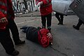 Ukrainian Red Cross volunteers performing first medical aid to a wounded protester. Clashes in Kyiv, Ukraine. Events of February 18, 2014