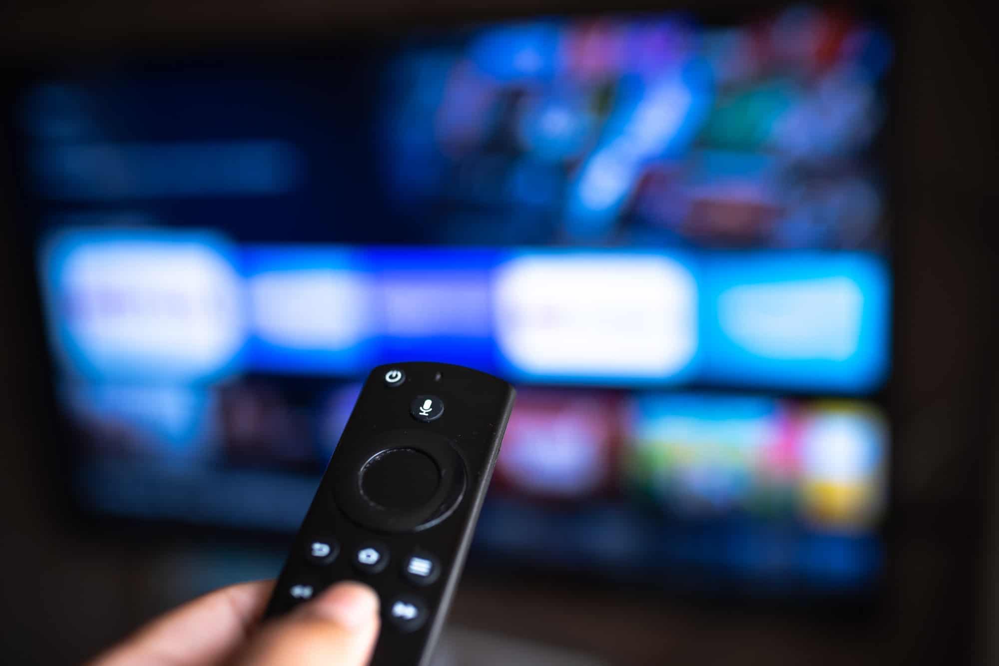 Amazon Fire TV Stick with television in background