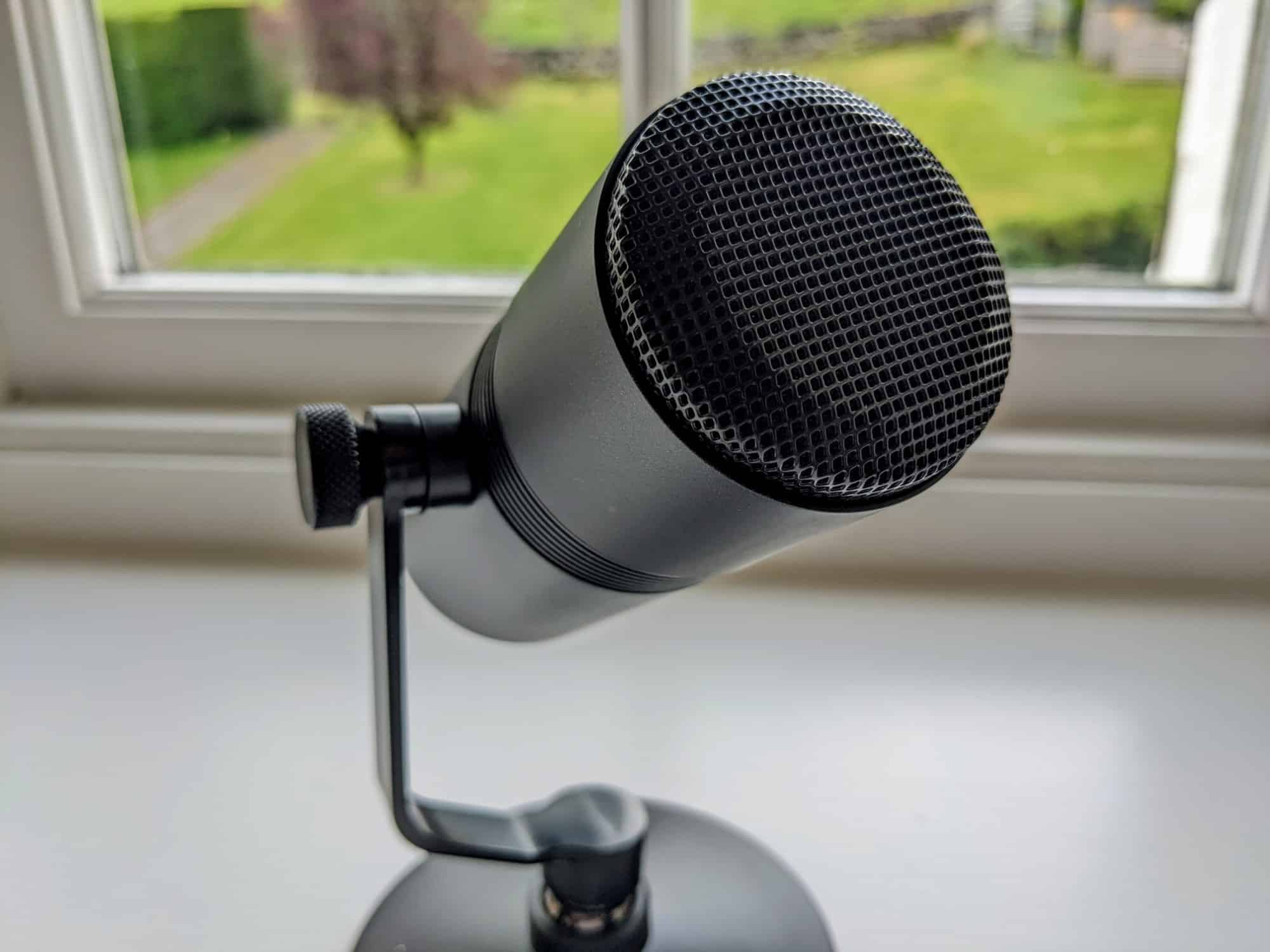 Anker M300 USB microphone sitting on window ledge