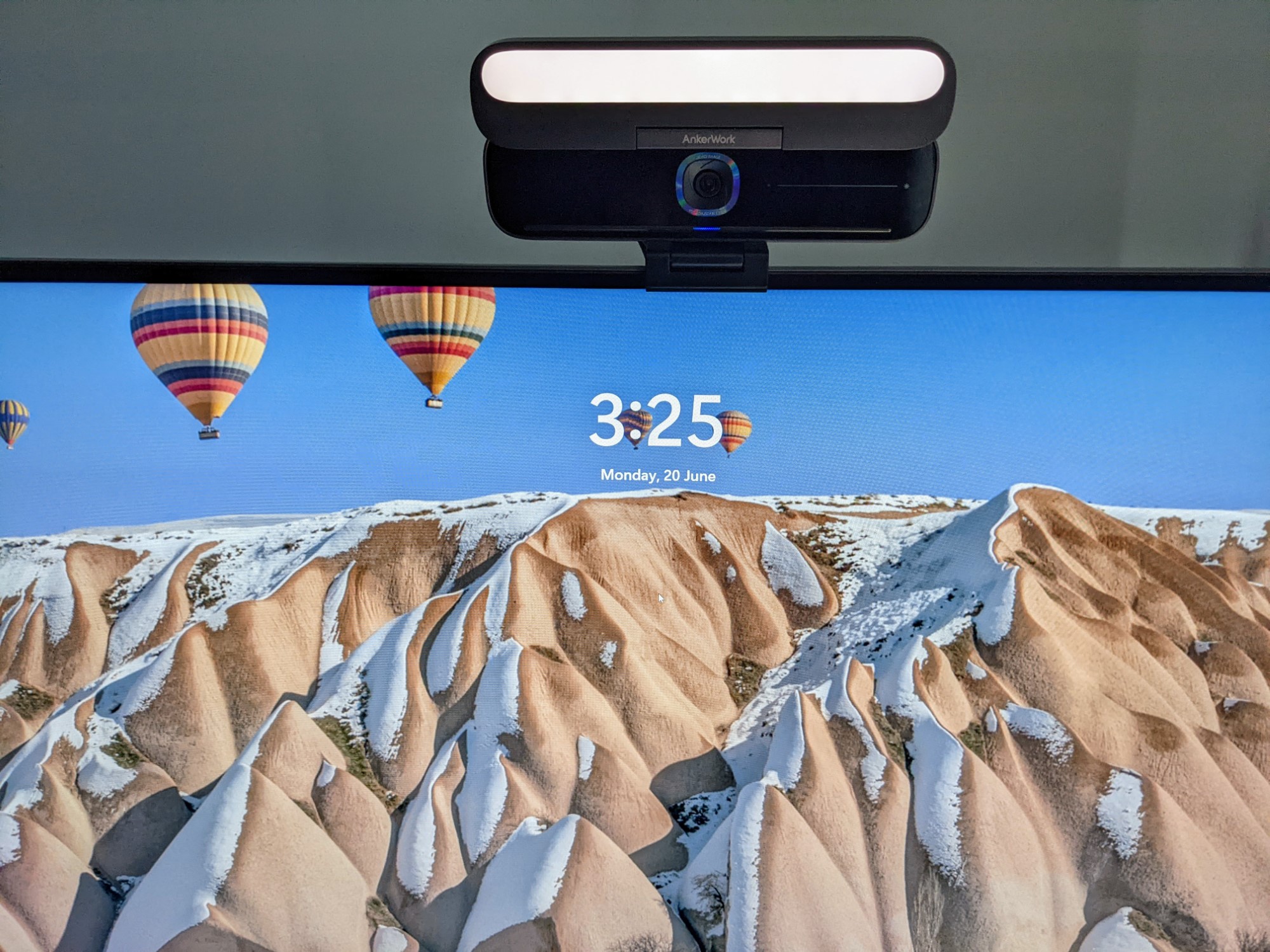 AnkerWork B600 video bar sitting on top of monitor