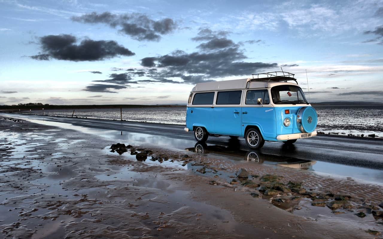Blue campervan on beach