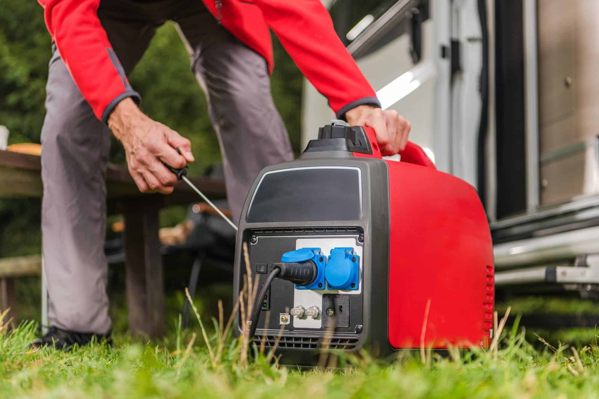 Man starting portable generator