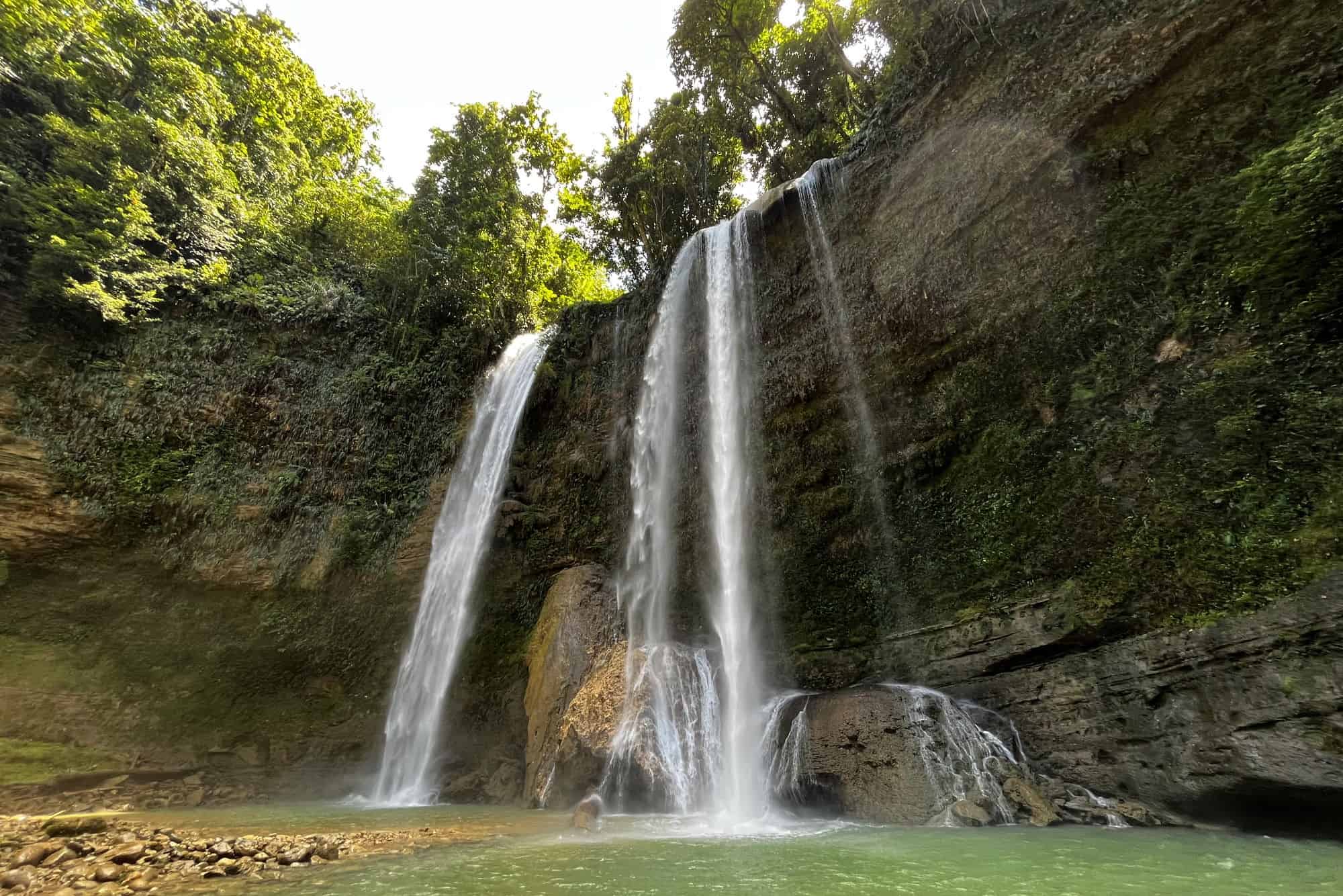 Waterfall in the Solomon Islands with trees above